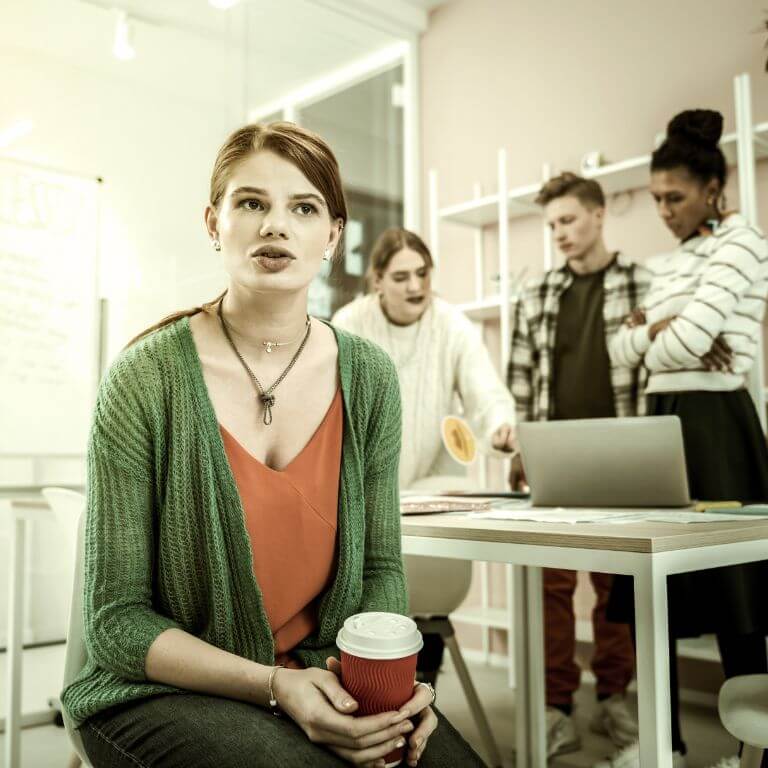 Needy Behavior. A lady feeling estranged from her colleagues