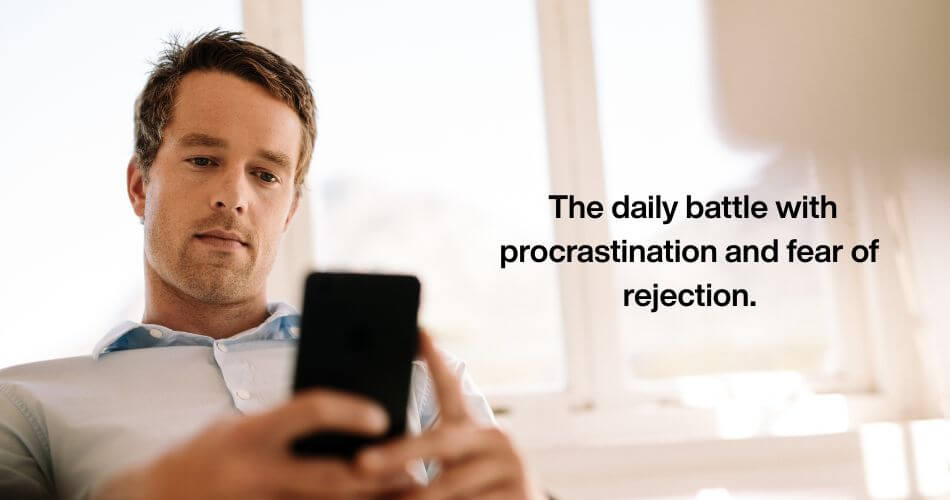 Real Estate Feast and Famine Cycle. An estate agent sitting at a desk, phone in hand, looking hesitant or anxious